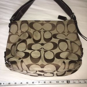 Coach bag. Slight wear in the strap which is pictured and on top rim of bag